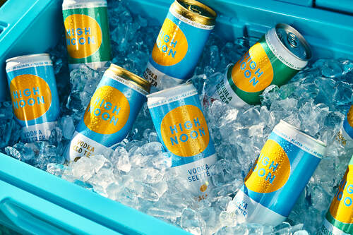 A Variety of High Noon cans on ice in an ice chest A Variety of High Noon cans on ice in an ice chest