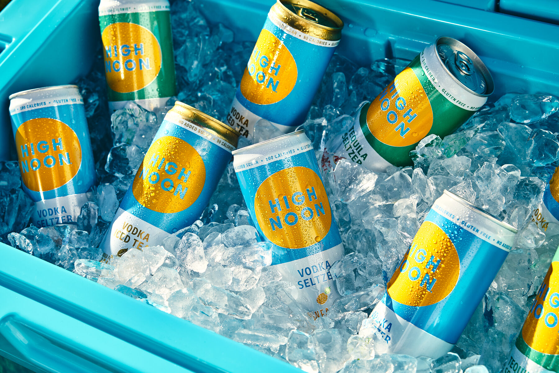 A Variety of High Noon cans on ice in an ice chest